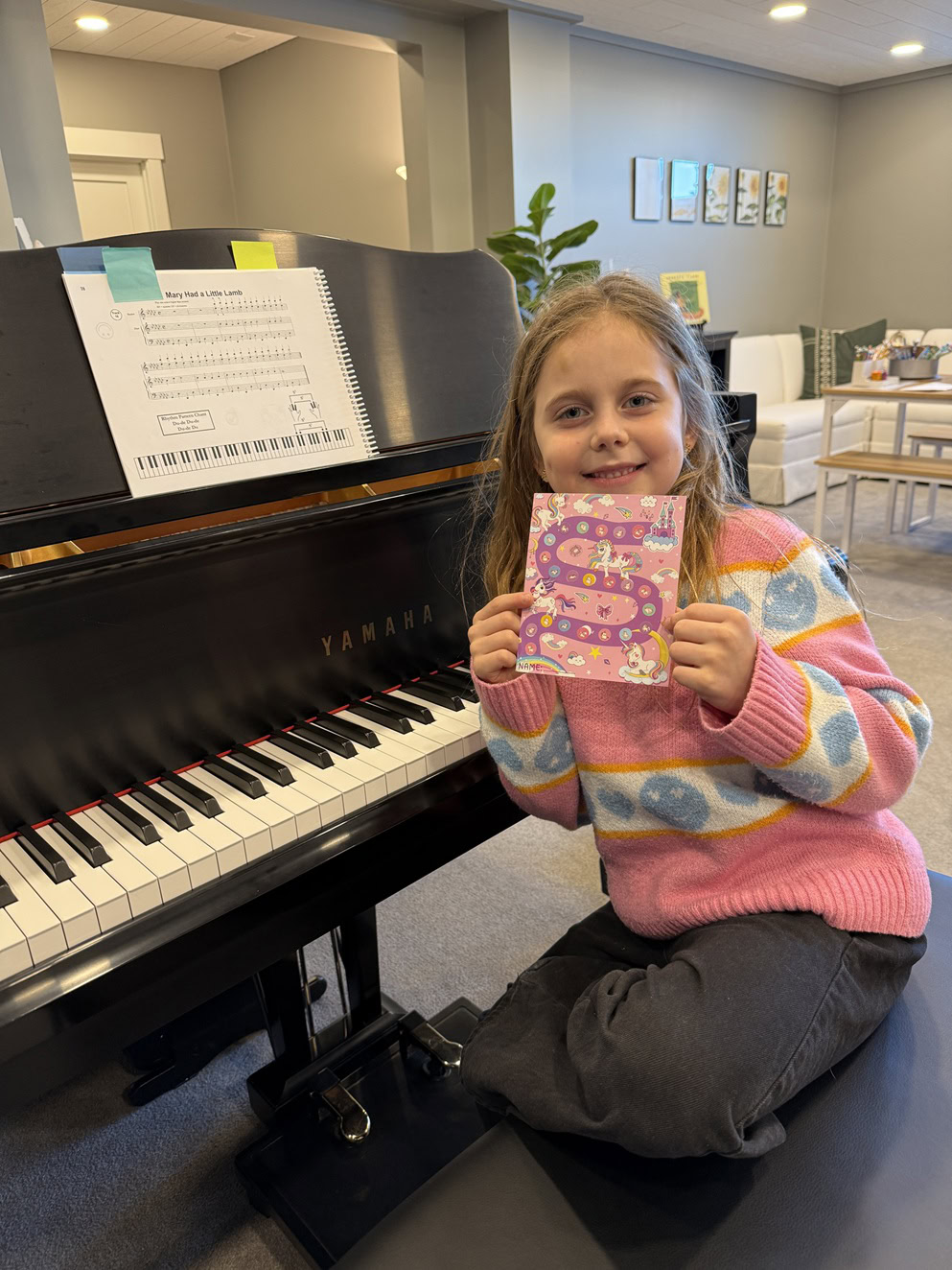 kiddo holding up her sticker chart